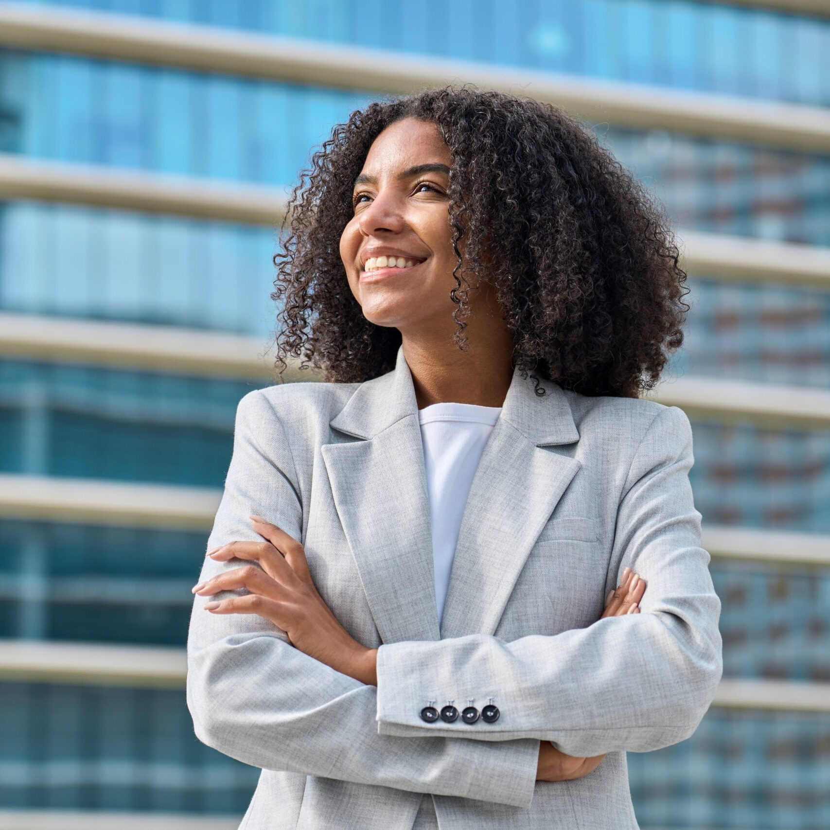 Happy,Young,African,American,Business,Woman,Standing,In,City,Looking