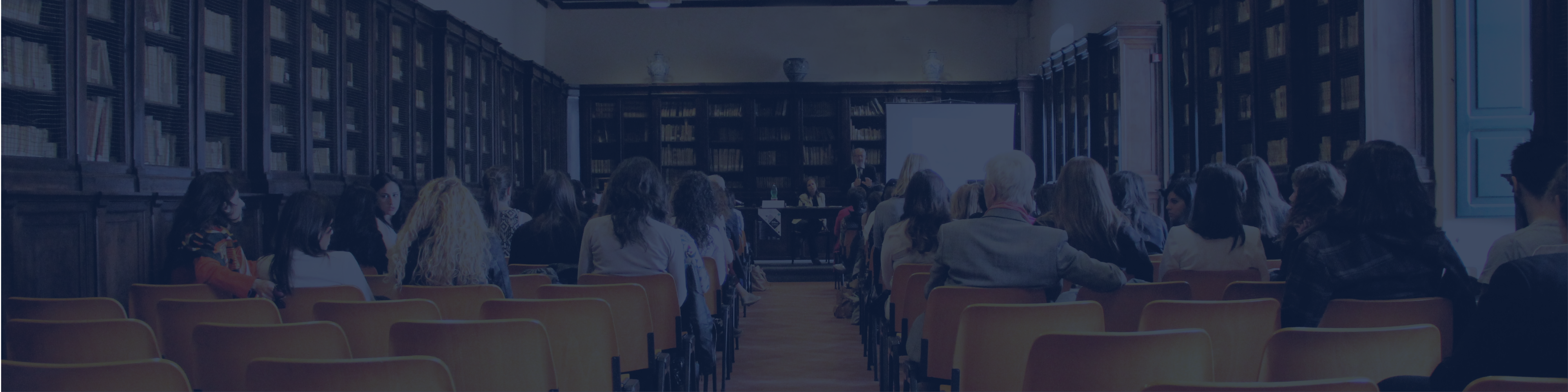 image of adults in a presentation setting in a library